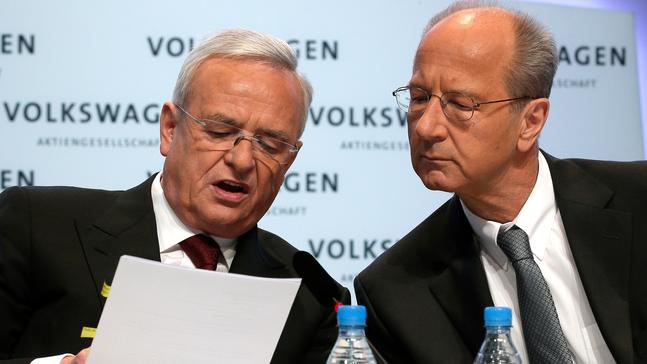 FILE - In this March 13, 2014 file photo then Volkswagen CEO Martin Winterkorn, left, and then CFO Hans Dieter Poetsch, right, talk prior to the company's annual press conference in Berlin, Germany.{&nbsp;} (AP Photo/Michael Sohn, file)