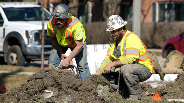 FILE - Construction workers work in Mount Prospect, Ill., Monday, Feb. 26, 2024. (AP Photo/Nam Y. Huh)