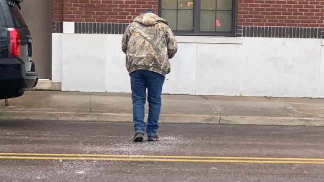 A Muskogee, Okla., woman posted these sweet photos of her father showing up to her work this week and pouring salt on the ground so she wouldn’t slip walking inside. (Provided photos: Elizabeth Bautista Boyd)