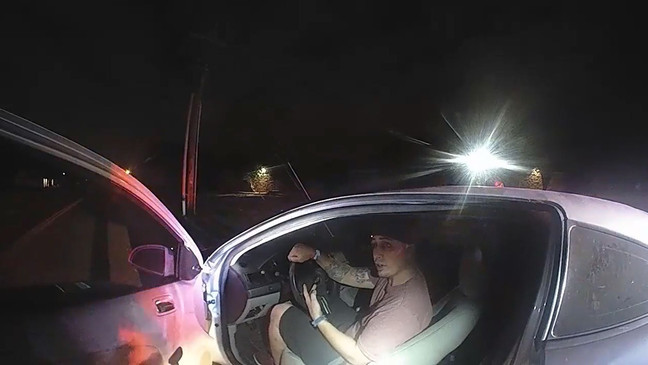 This still image from video provided Monday, Sept. 14, 2020, by the Tulsa Police Department shows the encounter of two officers with David Ware after a traffic stop in the overnight hours June 29. The video shows Officer Aurash Zarkeshan and Sgt. Craig Johnson trying to get Ware out of the car, and Ware shooting the officers during a struggle.