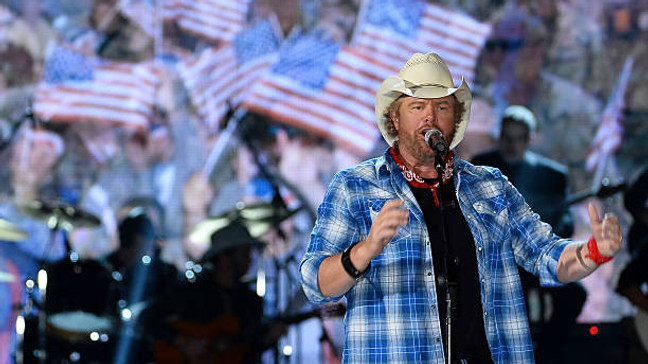 LAS VEGAS, NV - APRIL 07:  Recording artist Toby Keith performs during ACM Presents: An All-Star Salute To The Troops at the MGM Grand Garden Arena on April 7, 2014 in Las Vegas, Nevada.  (Photo by Ethan Miller/Getty Images for ACM)