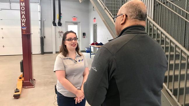 Kettering University Auto Drive Challenge team member Olivia Wanless speaks with anchor Mike Woolfolk{&nbsp;} about his role on the Bulldog Bolt team.  (Photo: Kettering University)