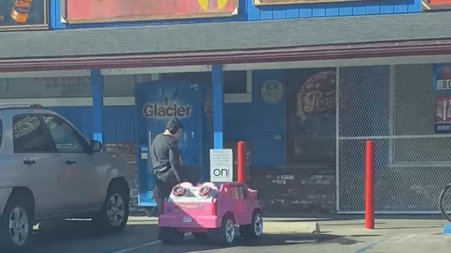 A Visalia man was casually going through his day when he spotted a young boy pulling up to the neighborhood store to buy stuff on a pink toy car. (Photo: Eric Sapien)