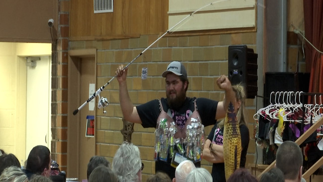 Men model special designed bras{ }for the "Bras for a Cause" charity auction. (KTVO)