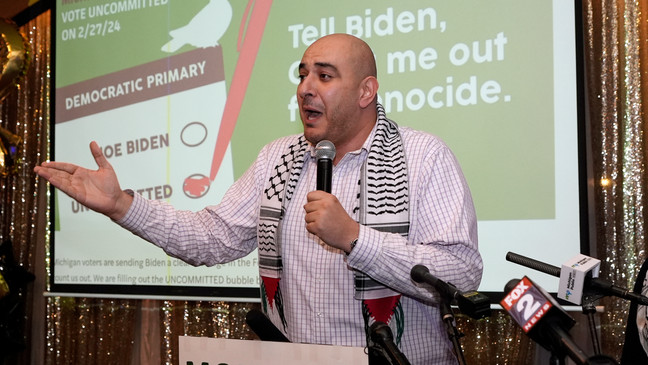 Abbas Alawich speaks during an election night gathering, Tuesday, Feb. 27, 2024, in Dearborn, Mich. (AP Photo/Carlos Osorio)