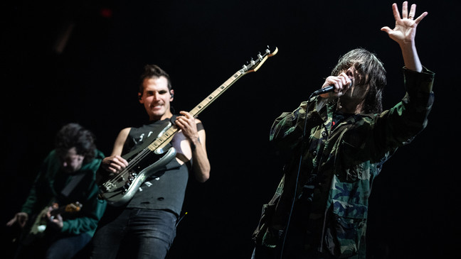 From L-R, Ray Toro, Mikey Way and Gerard Way of My Chemical Romance performs at the Moda Center in Portland, Ore. (Photo by Tristan Fortsch for KATU)