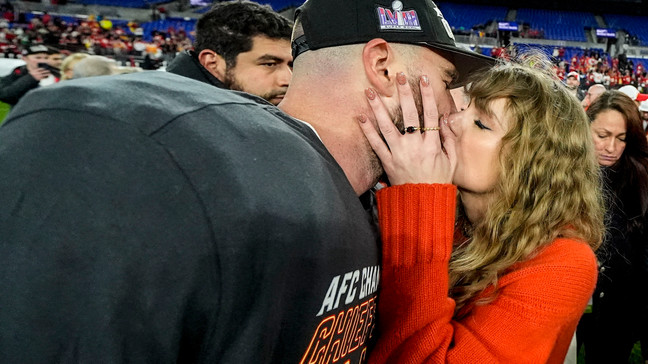 Taylor Swift kisses Kansas City Chiefs tight end Travis Kelce after an AFC Championship NFL football game against the Baltimore Ravens, Sunday, Jan. 28, 2024, in Baltimore. (AP Photo/Julio Cortez)