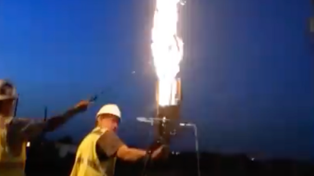 Manager creates flaming hot dog cooker to demonstrate fire safety. (Gary Dykman)