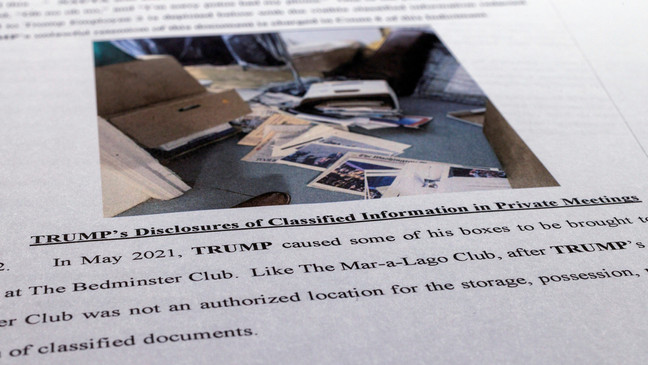FILE - The indictment against former President Donald Trump is photographed on Friday, June 9, 2023. The federal judge presiding over the classified documents case against former President Donald Trump is hearing arguments Friday, June 21, 2024, on a long-shot defense effort to get the indictment thrown out based on the claim that the prosecutor who brought the charges was illegally appointed. (AP Photo/Jon Elswick, File)