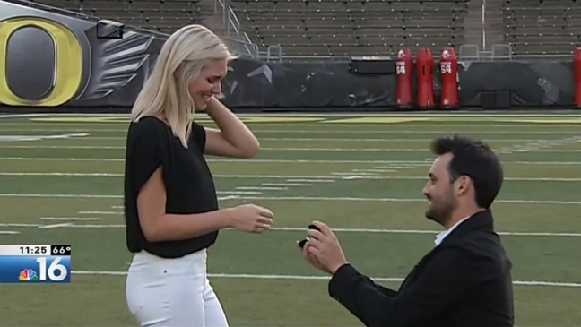 Sports producer Alex Altman proposes to his college sweetheart Jessica Waite at Autzen Stadium on August 11, 2018.{p}{/p}