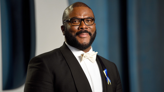 FILE - Tyler Perry arrives at the Vanity Fair Oscar Party at the Wallis Annenberg Center for the Performing Arts in Beverly Hills, Calif., Sunday, March 27, 2022. AARP announced Thursday, July 28, 2022, that Perry will receive the honorary AARP Purpose Prize award during a live ceremony on Oct. 25. The famed filmmaker-actor-philanthropist will be recognized for his work through The Perry Foundation. (Photo by Evan Agostini/Invision/AP, File)