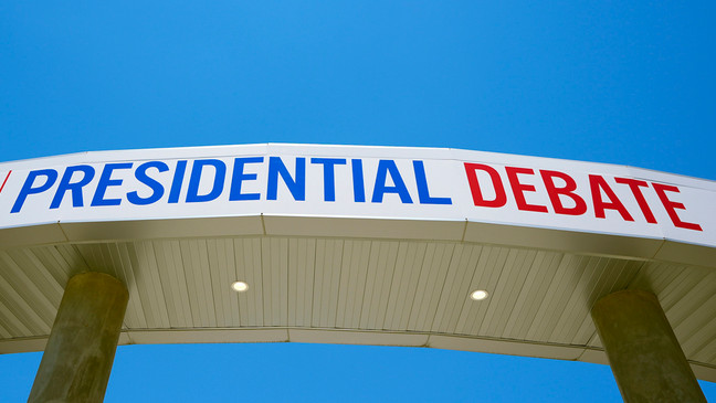 Signage for the upcoming presidential debate is seen at the media file center near the CNN Techwood campus in Atlanta on Tuesday, June 25, 2024. A new poll finds that most U.S. adults plan to watch or listen to some element of Thursday's presidential debate. (AP Photo/Pablo Martinez Monsivais)