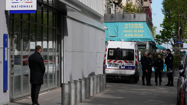 Police officers stand outside the police station where French actor Gerard Depardieu is expected to be questioned, Monday, April 29, 2024 in Paris. French media are reporting that police have summoned actor Gérard Depardieu for questioning about allegations made by two women that he sexually assaulted them on movie sets. (AP Photo/Michel Euler)