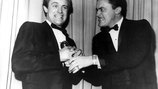 David McCallum and Robert Vaughn, stars of the television spy series 'The Man From UNCLE', pretend to fight over the Golden Globe Award they received for 'the most popular television series' at the Hollywood Foreign Press Association's annual award dinner. (Photo by Keystone/Getty Images)