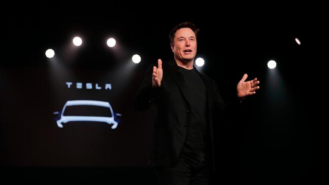 Tesla CEO Elon Musk speaks before unveiling the Model Y at Tesla's design studio Thursday, March 14, 2019, in Hawthorne, Calif. (AP Photo/Jae C. Hong)