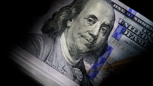 FILE - The likeness of Benjamin Franklin is seen on U.S. $100 bills, Thursday, July 14, 2022, in Marple Township, Pa. (AP Photo/Matt Slocum)