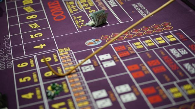 FILE - Nevada casinos set a record in November 2021, reporting a ninth straight month of $1 billion or more in house winnings in a sign that business in the nation's tourist dependent gambling mecca has returned to pre-coronavirus pandemic levels. (AP Photo/John Locher,File)