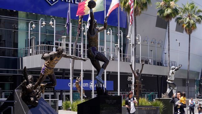 FILE - People visit the Star Plaza of Crypto.com Arena on July 25, 2023, in Los Angeles.{&nbsp;} (AP Photo/Damian Dovarganes, File)