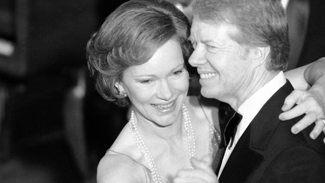 FILE - In this Dec. 13, 1978, file photo, President Jimmy Carter and his wife Rosalynn lead their guests in dancing at the annual Congressional Christmas Ball at the White House in Washington.{&nbsp;} (AP Photo/Ira Schwarz, File)