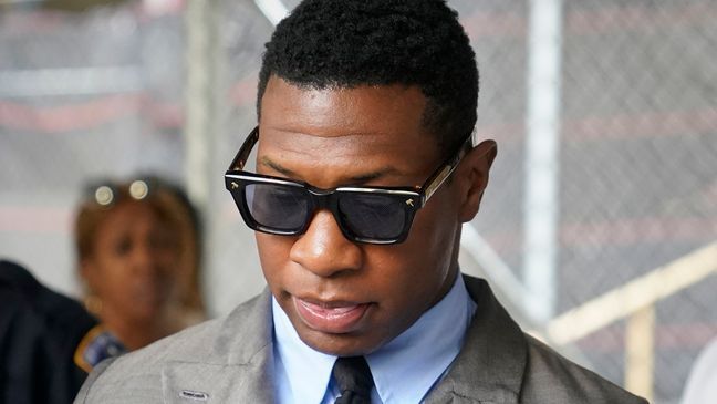 Jonathan Majors leaves court after a hearing on his domestic violence case, Thursday, Aug. 3, 2023, in New York. (AP Photo/John Minchillo)