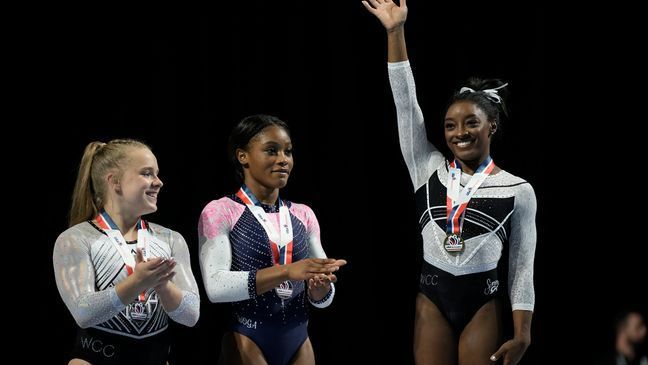 FILE - Simone Biles reacts after winning in the floor exercise at the U.S. Classic gymnastics competition Saturday, Aug. 5, 2023, in Hoffman Estates, Ill. (AP Photo/Morry Gash)