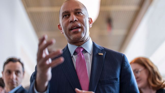 House Minority Leader Hakeem Jeffries, D-N.Y., walks with reporters after lawmakers pushed a $95 billion national security aid package for Ukraine, Israel and other U.S. allies closer to passage, at the Capitol in Washington, Friday, April 19, 2024. (AP Photo/J. Scott Applewhite)