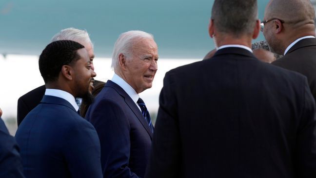 President Joe Biden greets people after arriving at Harry Reid International Airport in Las Vegas, Monday, July 15, 2024. (AP Photo/Susan Walsh)