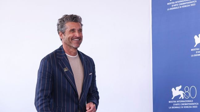 FILE - Patrick Dempsey poses for photographers during the photo call for the film "Ferrari" during the 80th edition of the Venice Film Festival, Aug. 31, 2023, in Venice, Italy. On Tuesday, Nov, 7, People magazine named Dempsey as its Sexiest Man Alive. (Photo by Vianney Le Caer/Invision/AP, File)