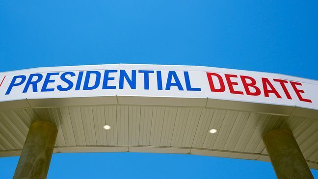 Signage for the upcoming presidential debate is seen at the media file center near the CNN Techwood campus in Atlanta on Tuesday, June 25, 2024. A new poll finds that most U.S. adults plan to watch or listen to some element of Thursday's presidential debate. (AP Photo/Pablo Martinez Monsivais)