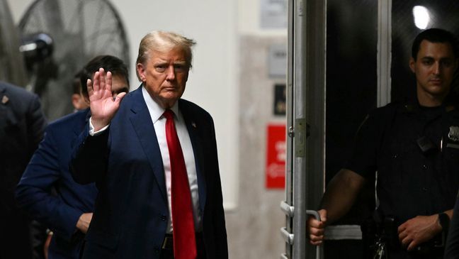 Former President Donald Trump gestures as he returns to court after a lunch break, at Manhattan criminal court in New York, on Thursday, May 16, 2024.  (Angela Weiss/Pool Photo via AP)