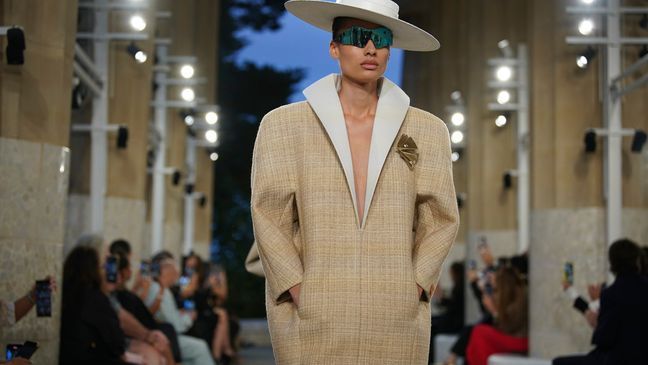 A model wears a creation by Louis Vuitton during a fashion show for the Cruise 2025 collection in the Park Guell in Barcelona, Spain, Thursday, May 23, 2024. (AP Photo/Joan Mateu)