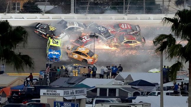 Multiple cars, including Austin Dillon (3), Daniel Suarez (41), David Ragan (38), Paul Menard (21), Ryan Newman (6), Aric Almirola (10), Matt DiBenedetto (95) and Ryan Blaney (12) crash during a NASCAR Daytona 500 auto race Sunday, Feb. 17, 2019, at Daytona International Speedway in Daytona Beach, Fla. (AP Photo/Chris O'Meara)