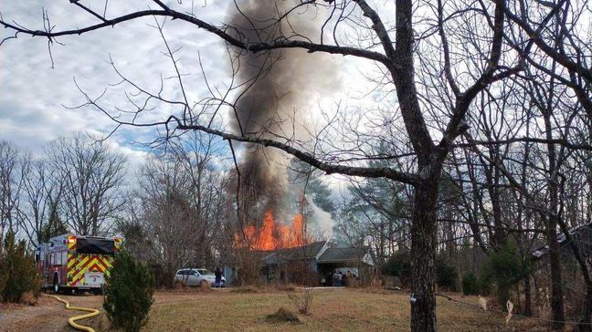 Firefighters found heavy fire showing from the roof of the house when they arrived (Henry Volunteer Fire Department)