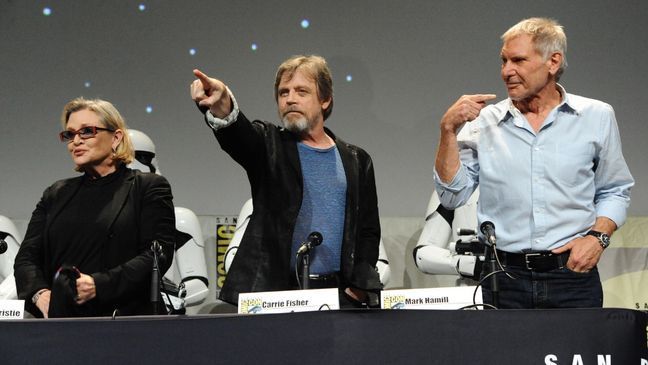 Carrie Fisher, from left, Mark Hamill, and Harrison Ford attend Lucasfilm's "Star Wars: The Force Awakens" panel on day 2 of Comic-Con International on Friday, July 10, 2015, in San Diego, Calif. (Photo by Richard Shotwell/Invision/AP)