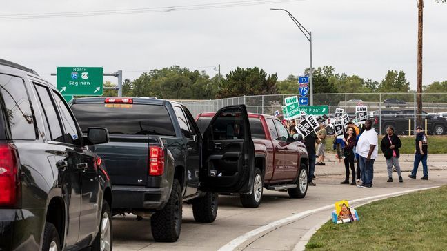 Protesting union members prevent cars from driving into the General Motors Flint Assembly Plant on Bristol Road as United Automobile Workers remain on strike against GM on Tuesday, Sept. 17, 2019, in Flint, Mich. GM and the union are faced with weakening vehicle sales, a deteriorating global economy and an unpredictable trade war.  (Sara Faraj/MLive.com/The Flint Journal via AP)