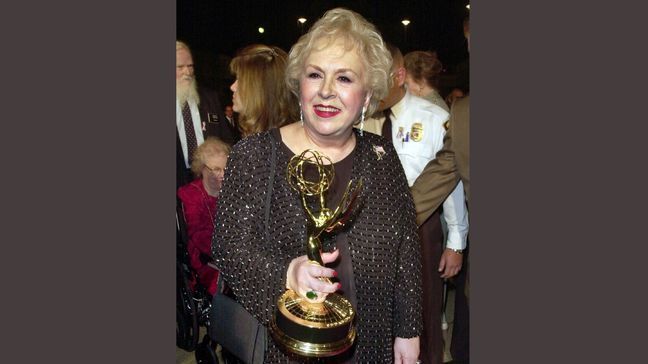 FILE - In this Nov. 4, 2001 file photo, Doris Roberts holds her Emmy for outstanding supporting actress in a comedy series for her work on "Everybody Loves Raymond" following the 53rd annual Primetime Emmy Awards in Los Angeles. Family spokeswoman said Monday, April 18, 2016, that Roberts died overnight Sunday in her sleep in Los Angeles. She was 90. (AP Photo/Kim D. Johnson, File)