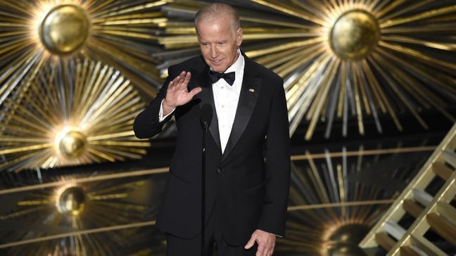 In this Feb. 28, 2016 file photo, Vice President Joe Biden introduces a performance by Lady Gaga at the Oscars at the Dolby Theatre in Los Angeles. Lady Gaga and Biden are bringing their act to Las Vegas for an event raising awareness about sexual assault. The pop star and the vice president will hold a rally at the University of Nevada, Las Vegas, on April 7. (Photo by Chris Pizzello/Invision/AP, File)