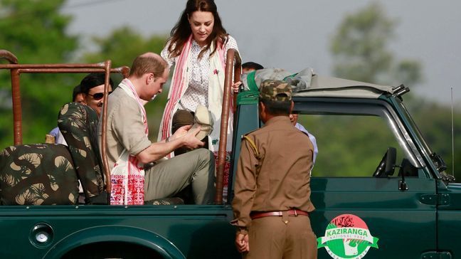 Britain's Prince William, left, along with Kate, the Duchess of Cambridge, board a jeep for a safari at Kaziranga National Park, east of Gauhati, northeastern Assam state, India Wednesday, April 13, 2016. Prince William and his wife, Kate, planned their visit to Kaziranga specifically to focus global attention on conservation. The 480-square-kilometer (185-square-mile) grassland park is home to the world's largest population of rare, one-horned rhinos as well as other endangered species including swamp deer and the Hoolock gibbon. (AP Photo/Anupam Nath)