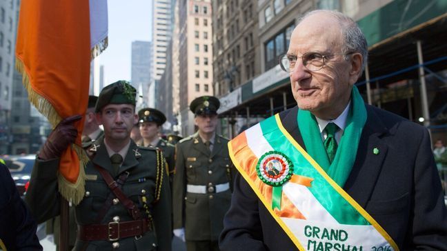 FILE - Members of the 28th Battalion Finner Camp of the Irish Army Reserve stand next to Former U.S. Sen. George Mitchell before the start of the St. Patrick's Day parade, Thursday, March 17, 2016, in New York.  (AP Photo/Mary Altaffer)