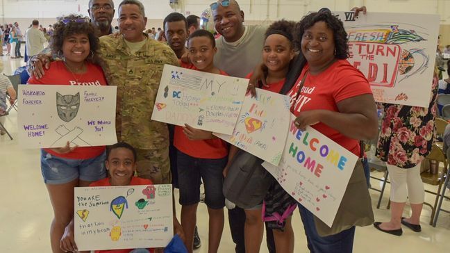 Staff Sergeant Douglas Eaves is greeted by his family after a ten month deployment in Kuwait. (Stephen Quinn | abc3340.com)