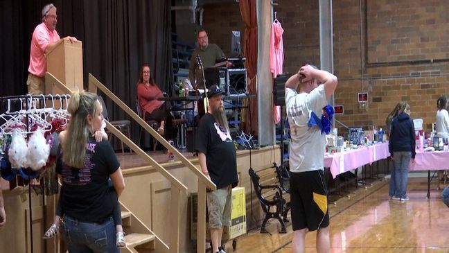 Men model special designed bras for the "Bras for a Cause" charity auction. (KTVO)