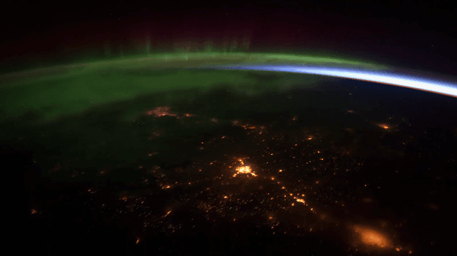 The focus is on the border of Canada and Washington state, near Vancouver Island to southern Alberta, near Calgary. The Aurora Borealis light show is in full swing. (Image courtesy of the Earth Science and Remote Sensing Unit, NASA Johnson Space Center -http://eol.jsc.nasa.gov)