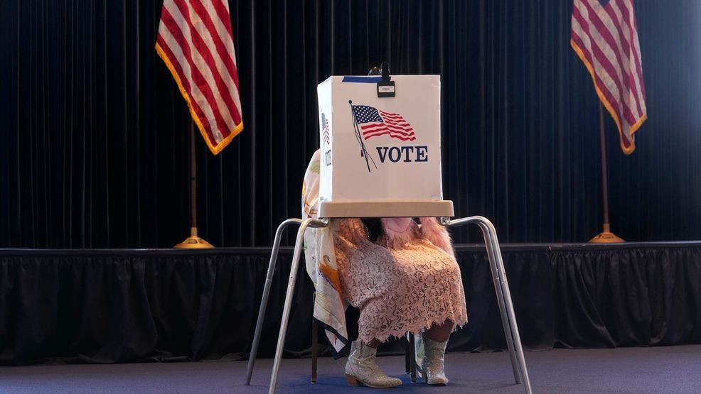 A voter works on her ballot at a polling place at the Ronald Reagan Presidential Library on Election Day, Tuesday, Nov. 5, 2024, in Simi Valley, Calif. (AP Photo/Chris Pizzello)