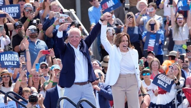 Democratic presidential nominee Vice President Kamala Harris is welcomed by Democratic vice presidential nominee Minnesota Gov. Tim Walz, before she delivers remarks at a campaign event, Wednesday, Aug. 7, 2024, in Eau Claire, Wisc. (AP Photo/Charles Rex Arbogast)