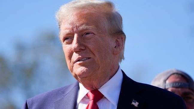 Republican presidential nominee former President Donald Trump listens to others after delivering remarks on the damage and federal response to Hurricane Helene, Monday, Oct. 21, 2024, in Swannanoa, N.C. (AP Photo/Evan Vucci)