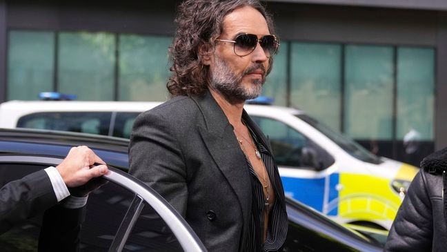 English comedian and actor Russell Brand arrives at Southwark Crown Court where he is charged with rape and sexual assault in London, Friday, May 30, 2025.(AP Photo/Alastair Grant)