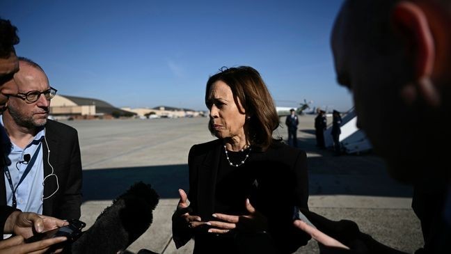 Democratic presidential nominee Vice President Kamala Harris talks to reporters before boarding Air Force Two, Wednesday, Oct. 30, 2024, at Joint Base Andrews, Md. (Brendan Smialowski/Pool via AP)