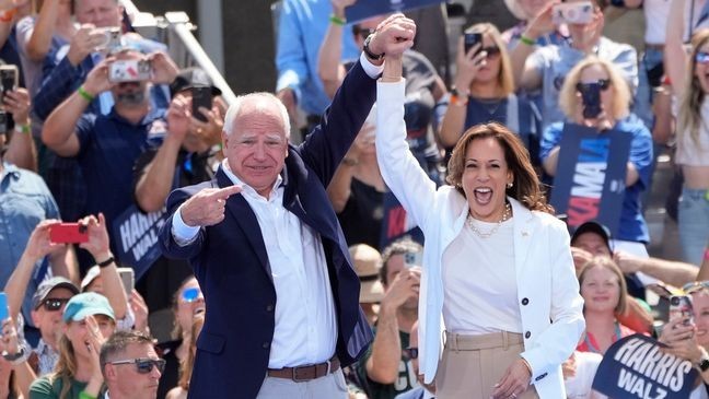 Democratic presidential nominee Vice President Kamala Harris is welcomed by Democratic vice presidential nominee Minnesota Gov. Tim Walz, before she delivers remarks at a campaign event, Wednesday, Aug. 7, 2024, in Eau Claire, Wisc. (AP Photo/Charles Rex Arbogast)