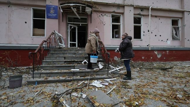 Women clear the rubble from a sports center damaged by a Russian strike in Zaporizhzhia, Ukraine, Nov. 11, 2024. (AP Photo/Kateryna Klochko)