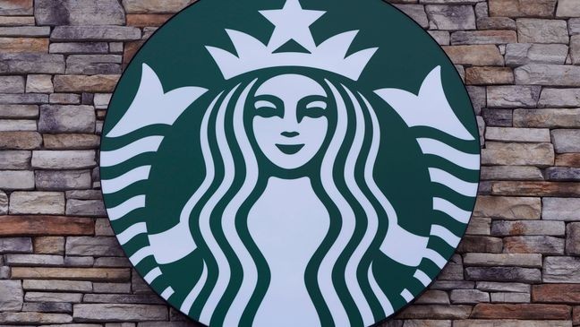 FILE - A Starbucks mermaid logo sign is displayed on a store, May 29, 2024, in Salem, N.H. (AP Photo/Charles Krupa, File)